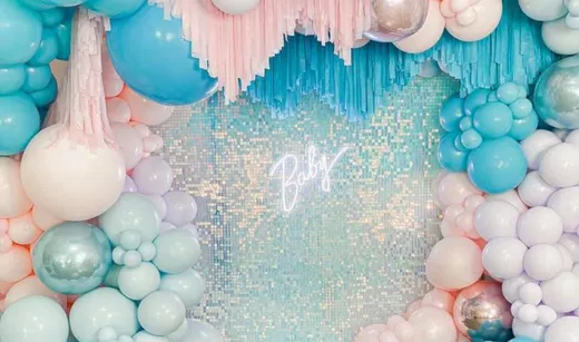 Gender reveal party decorations with balloons